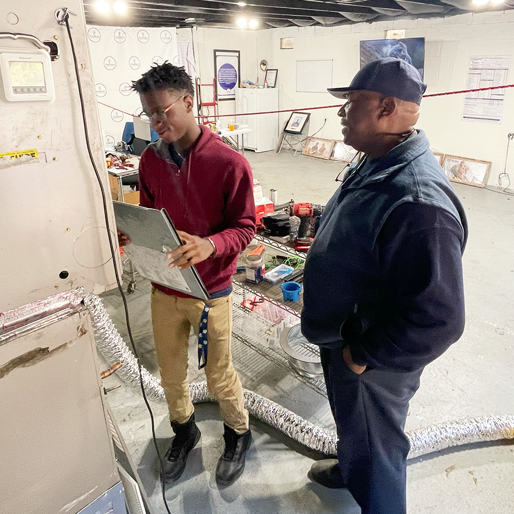 James Anderson training an HVAC student